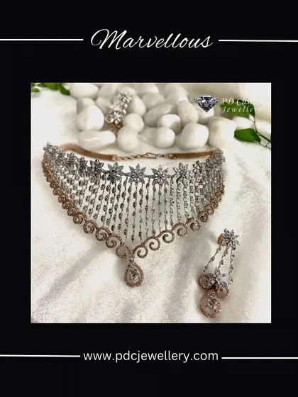 A marvelous diamond choker necklace set with a unique dangling design. The combination of rose gold and white gold with sparkling diamonds makes this a contemporary choice for a modern bride.