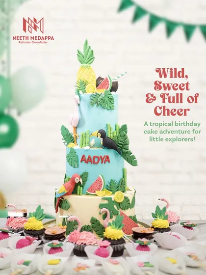 For Aadya's birthday, we created a tropical paradise. This dessert spread features a three-tiered jungle cake with hand-sculpted parrots, toucans, and flamingos, complemented by matching pineapple cupcakes and flamingo cakesicles.