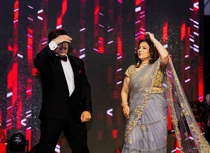 The parents of the bride or groom having fun with a classic Bollywood move.