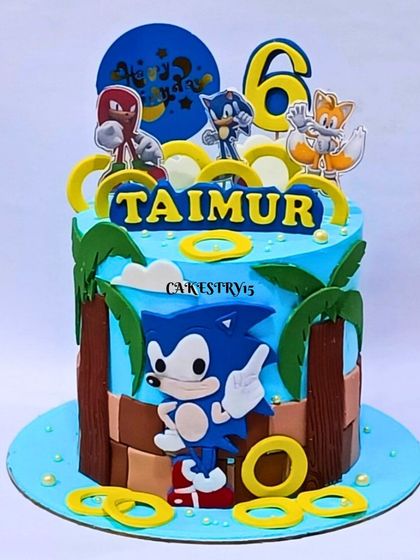 A speedy single-tier Sonic the Hedgehog cake for a 6th birthday. The design features Sonic, Tails, and Knuckles in a classic game-level setting with golden rings.