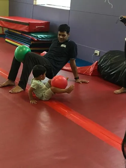 Playtime with dad. Using simple props like balls, our classes incorporate exercises that parents and children can do together to improve coordination.