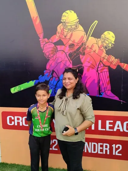A proud moment for a young player and his parent during the presentation ceremony.