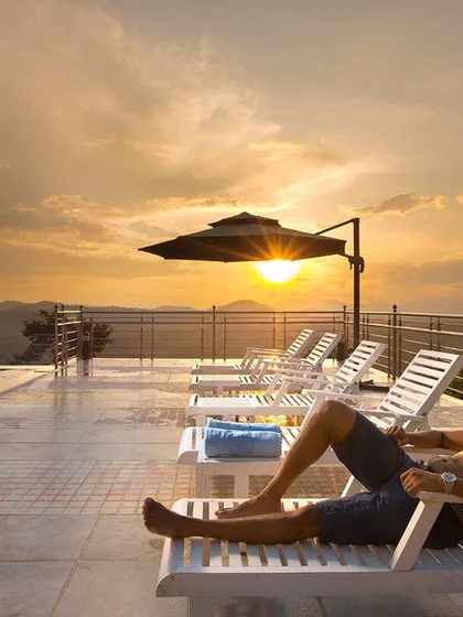 Soaking in the sunset from the infinity pool at Coorg Cliffs Resort. This is the kind of luxurious relaxation I can arrange for you, with panoramic views of the Western Ghats.
