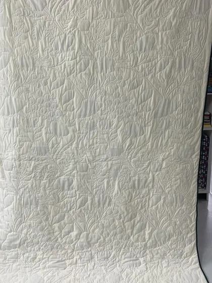 The back of the embroidered floral quilt.
