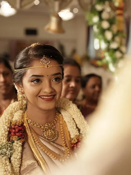 The perfect candid shot of a bride seeing her final look. For this daylight muhurtham, I created a minimal and fresh look with a lightweight base and soft features to ensure she looked effortlessly beautiful.