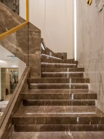 Another view of the staircase, showing the subtle glow of the step lights. This feature adds a layer of safety and creates a beautiful ambient effect in the evening.
