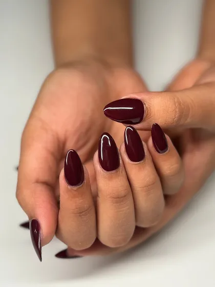 The full two-hand view of this classic and chic burgundy manicure. It's a color that never goes out of style.