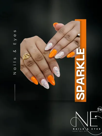 Let your nails sparkle. This design combines a bright orange with a shimmering silver glitter for a fun and eye-catching look.