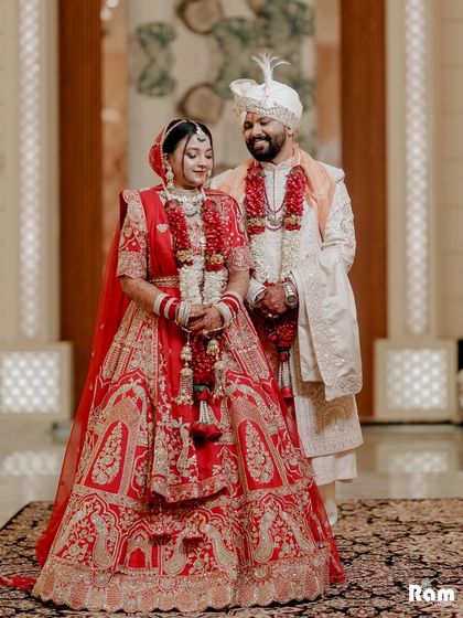 A beautiful portrait of the newly married couple, their outfits perfectly coordinated, capturing a moment of quiet connection.