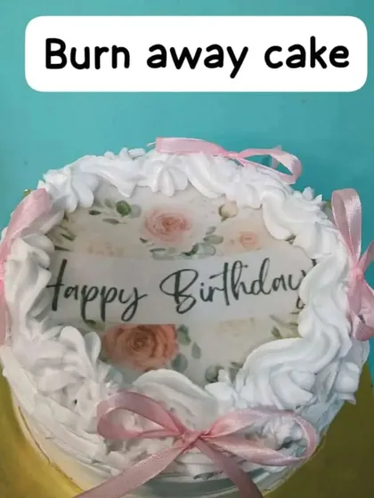 A simple and elegant burnaway cake with a "Happy Birthday" message hidden underneath.