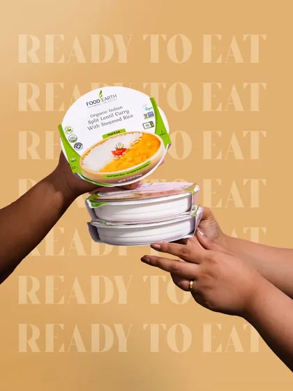 A dynamic shot featuring hands passing a ready-to-eat meal. This creates a sense of sharing and convenience, while the repeated text in the background reinforces the product's key selling point.