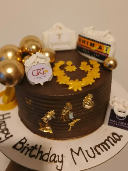 A fun and glamorous cake for a wife who loves shopping, featuring miniature shopping bags from her favorite jewelry brands.