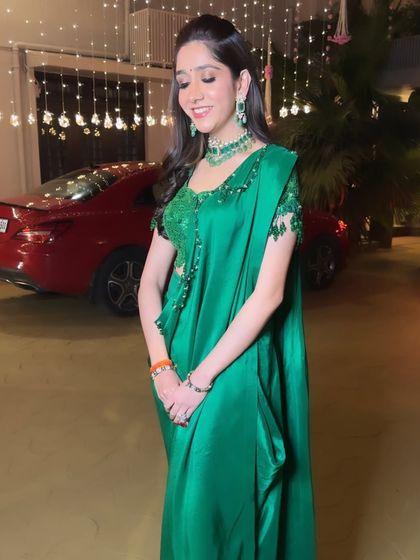 A candid shot capturing the beauty of this Sufi Night look. The makeup is kept minimal to let the vibrant green outfit and sparkling jewelry shine.
