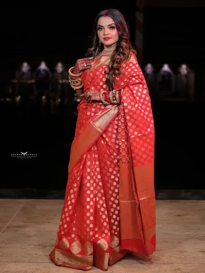 A three-quarter shot that highlights the rich fabric and the model's graceful posture.