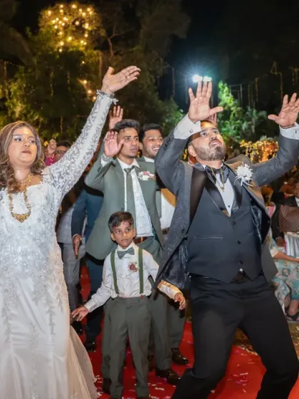 The grand entrance with hands in the air! This shot perfectly captures the celebratory mood as the couple and their page boy enter the reception.