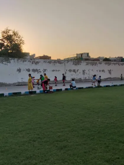 Skaters practicing along the edge of the court at dusk. Our evening batches are popular with many families.