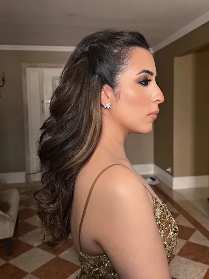 A soft half-up style with a simple twist, perfect for a Sangeet night.