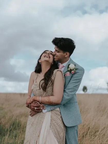 The joy of a wedding day captured in the beautiful English countryside. This image reflects our ability to shoot in diverse international locations, capturing candid happiness and natural romance.