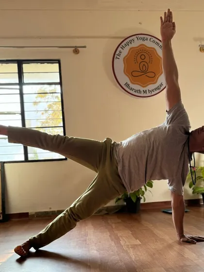 This is Vasisthasana (Side Plank Pose), a perfect example of integrating strength, balance, and flexibility. Yoga is more than just stretching; it is the union of these essential qualities.