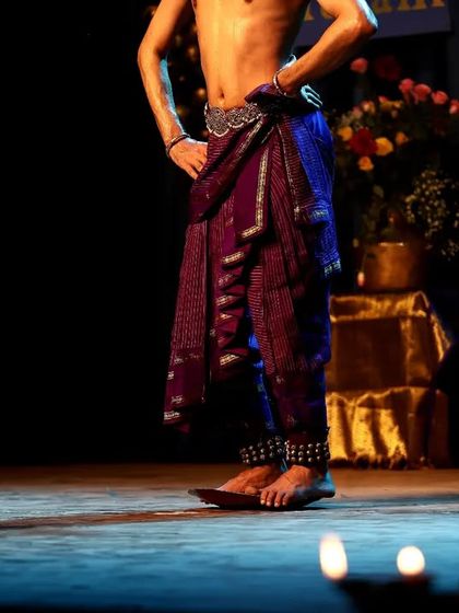 The foundation of Kuchipudi is its intricate footwork, or 'Aḍugulu'. This photo focuses on the dancer's stance and the ghungroo (ankle bells) that give rhythm to every step.