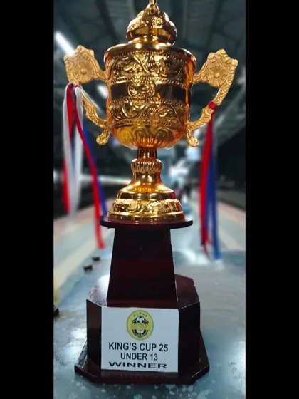 A close-up shot of the gleaming King's Cup U13 Winner's trophy. This trophy symbolizes the hard work, dedication, and success of our young champions.