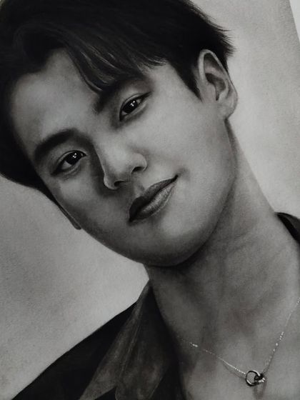 Another portrait I drew of the kindest soul, Ohm Pawat. This detailed graphite drawing focuses on capturing his gentle expression.