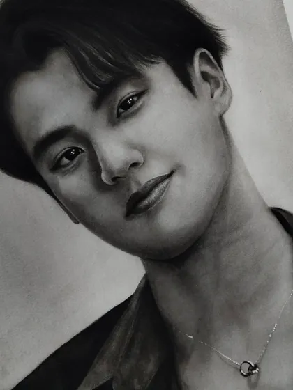 Another portrait I drew of the kindest soul, Ohm Pawat. This detailed graphite drawing focuses on capturing his gentle expression.