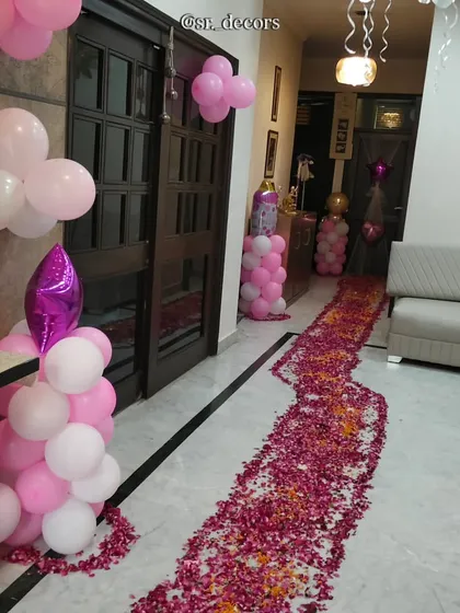 To make the baby's first steps into the home truly special, I design beautiful entrance pathways using fresh rose petals. This adds a traditional and elegant touch to your welcome baby ceremony, creating a memorable moment for the whole family.