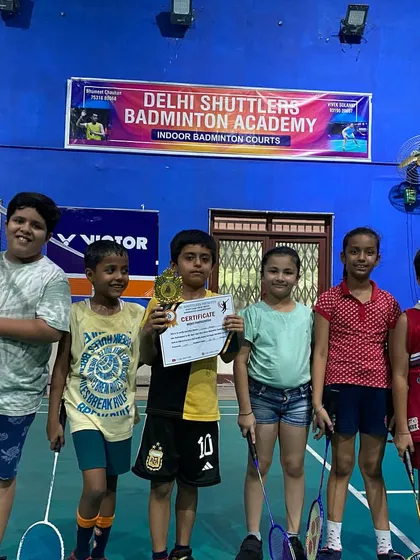 Celebrating the next generation of players. Here are some of our young students after a tournament, showcasing the achievements from our junior badminton program.