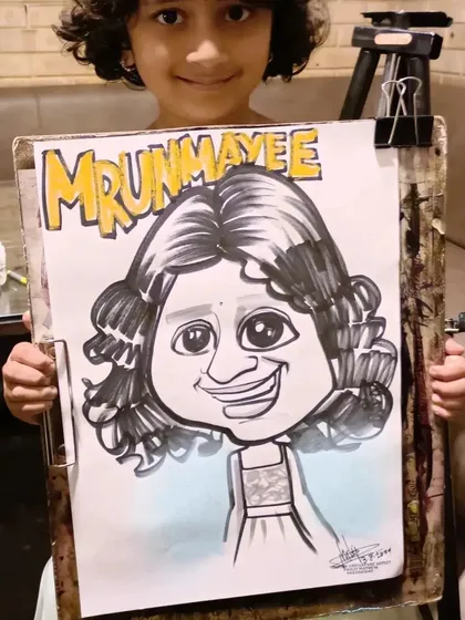 A little girl named Mrunmayee with her personalized caricature.
