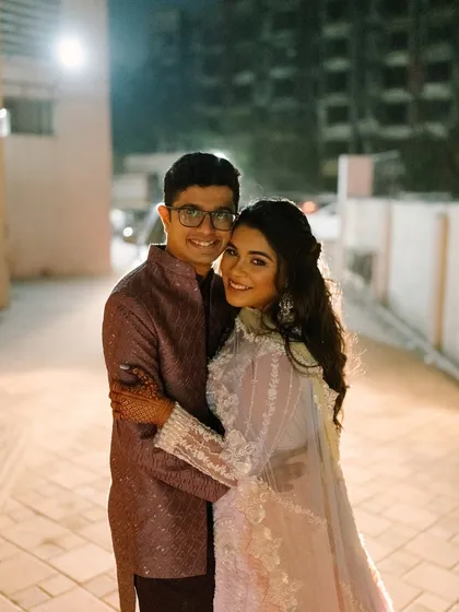 A sweet couple portrait from their engagement. The bride's soft glam makeup looks beautiful next to her partner.