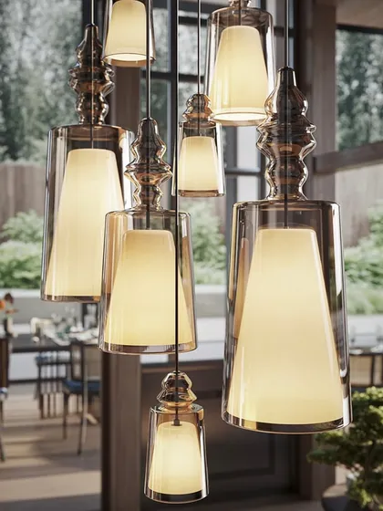 A close-up of a dense cluster of the pendants. This view highlights the beautiful details of the glass and the warm, inviting light they produce.