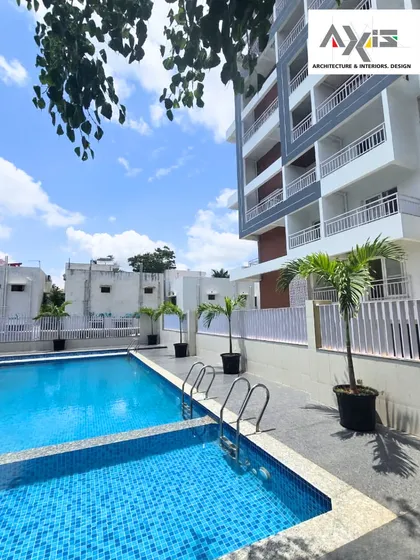 A swimming pool should be more than just a body of water; it should be an experience. For this apartment complex, I designed a poolside environment that feels like a private resort. The clean lines of the pool, combined with potted palms and the backdrop of modern architecture, create a refreshing oasis for relaxation and recreation.