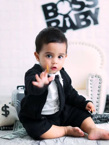 This baby is serious about his business. A candid moment from a 'Boss Baby' shoot, capturing a look of intense concentration.
