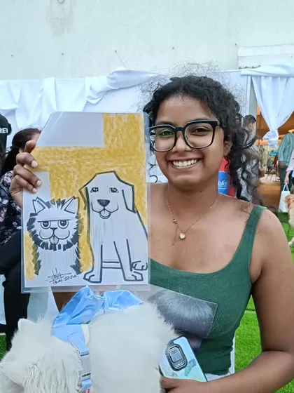 A guest with her cat and dog, both immortalized in a fun drawing.