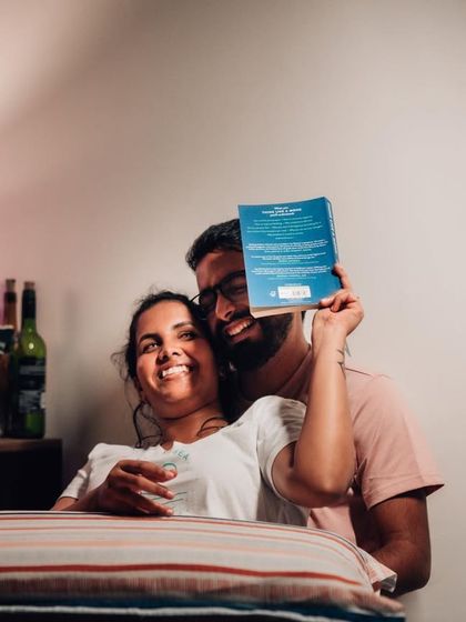 A playful and cozy at-home photo, where the couple shares a laugh. These relaxed sessions are perfect for capturing your authentic selves.