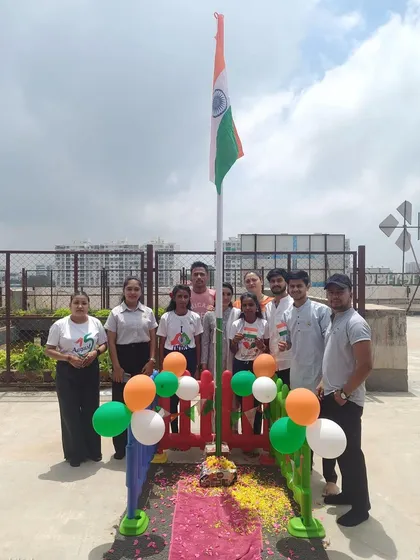 Celebrating Independence Day with pride. Our staff and some of our young visitors gather for a flag-hoisting ceremony, teaching the importance of our nation's history in a joyful way.