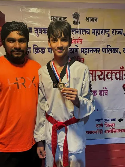 Here is another one of our dedicated students with his well earned medal at the district level Taekwondo competition. His focus during the event was excellent.