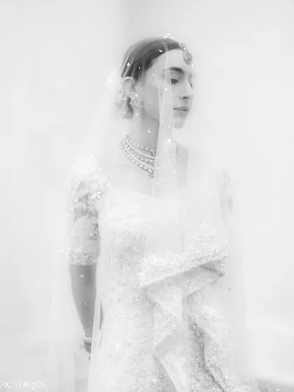 An artistic, high-key black and white portrait of Sejal. The soft focus and bright exposure give this image a dreamy, ethereal feel, focusing on emotion and form rather than just detail.