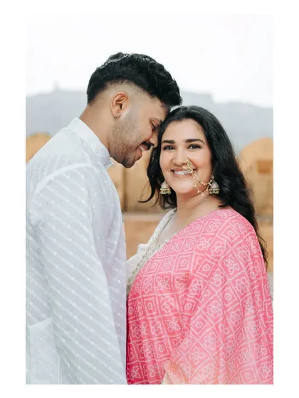 A happy and intimate close-up, capturing the bride's beautiful smile and traditional jewelry during her Jaipur pre-wedding shoot.