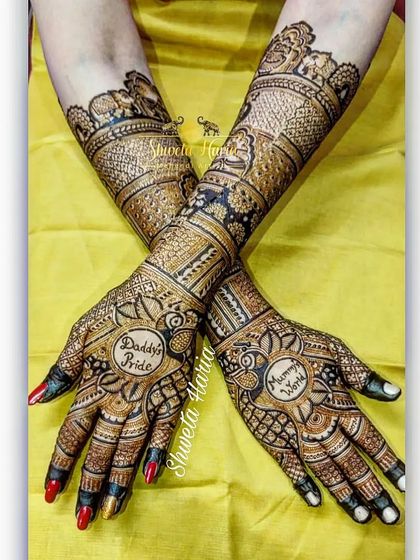 A tribute to family love, this back-hand design features the phrases "Daddy's Pride" and "Mommy's World" nestled within intricate peacock and floral patterns.