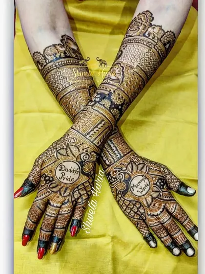 A tribute to family love, this back-hand design features the phrases "Daddy's Pride" and "Mommy's World" nestled within intricate peacock and floral patterns.