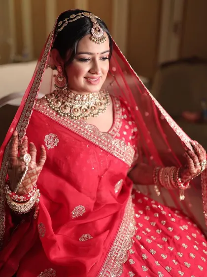 A candid shot of Krusha getting ready. Her bridal makeup looks flawless even in the moments before the final reveal.