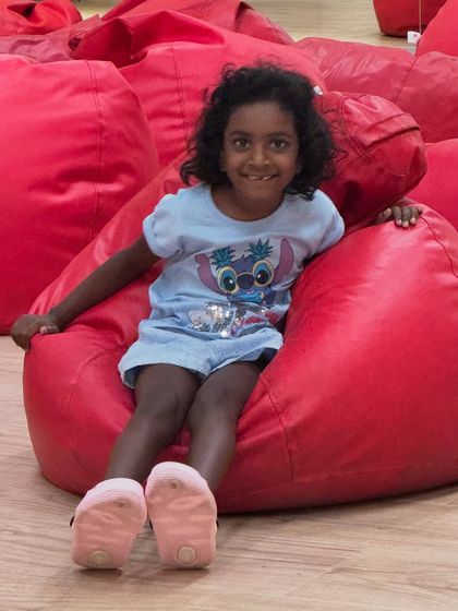 My daughter Kaadu, the 'special jury', enjoying the setup for a kids' storytelling event. Seeing events through a child's eyes helps me make them as fun as possible.