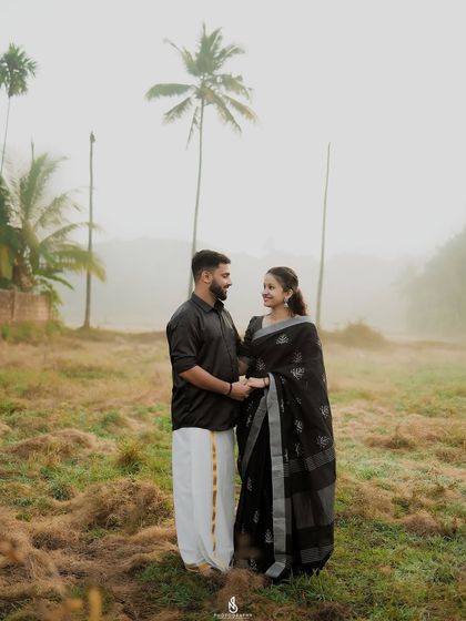 A quiet, connected moment holding hands in the misty morning light.