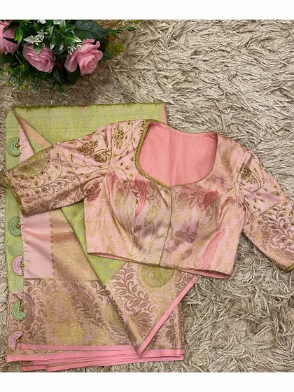 The front view of the pink and green coordinated set, highlighting the elegant neckline and the beautiful brocade fabric of the blouse.