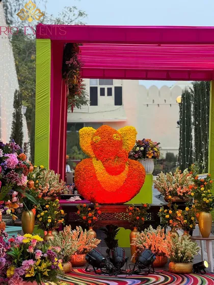 A floral Ganpati idol as the centerpiece for a Mehendi ceremony. I believe in starting every auspicious event with divine blessings, integrated beautifully into the overall decor theme.