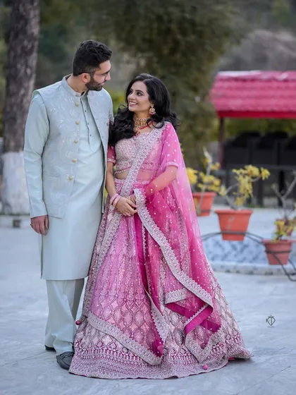 A candid moment of the couple looking at each other, their smiles reflecting their happiness.