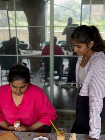 Watching over a student as she works on her painting. It's so rewarding to see their vision come to life.