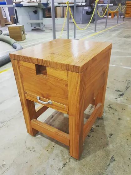 This piece is an ergonomic, back-friendly coconut grater, designed and built by a student. It features a pull-out drawer and a concealed grater, blending traditional utility with thoughtful, modern woodworking design.